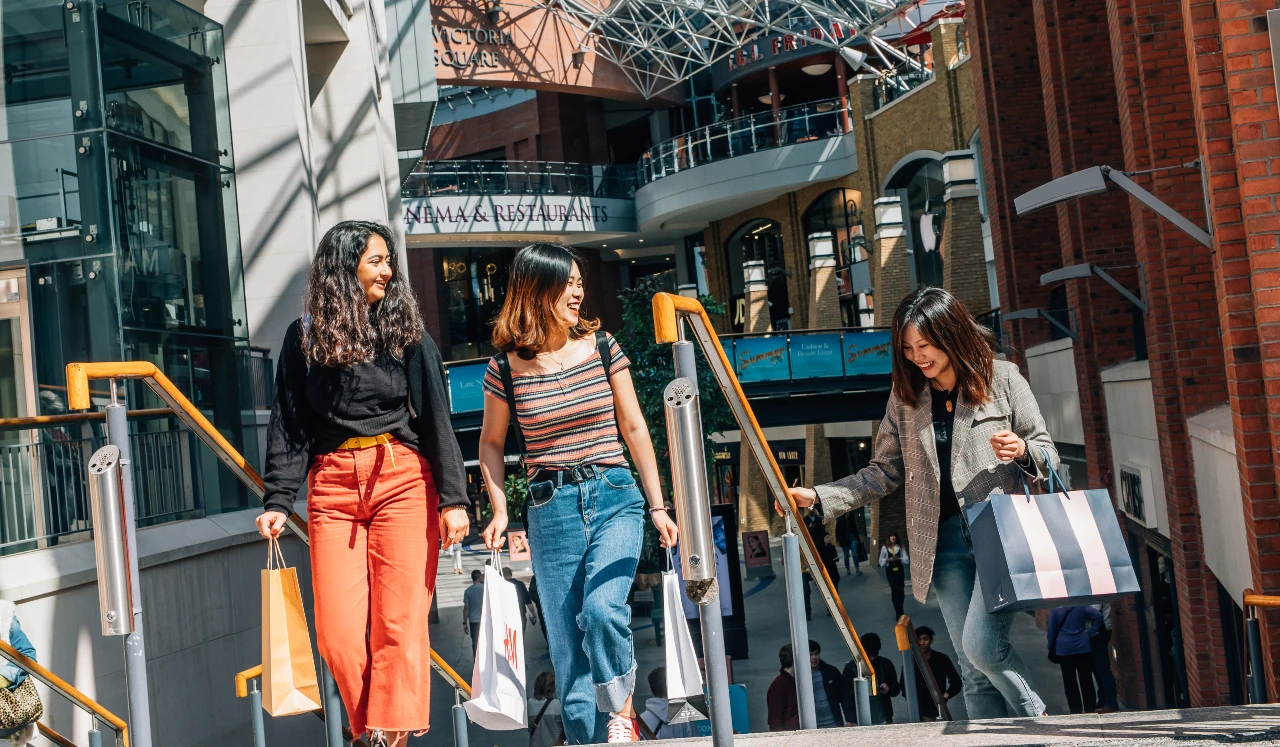 3 people shopping in Victoria Square, Belfast