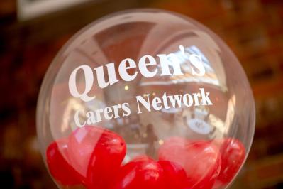 Image shows a balloon that reads: Queen's Carers Network
