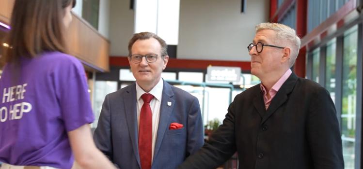 Beth Elder, Professor Sir Ian Greer and Sean O'Connell meeting in Queen's University Belfast Students' Union