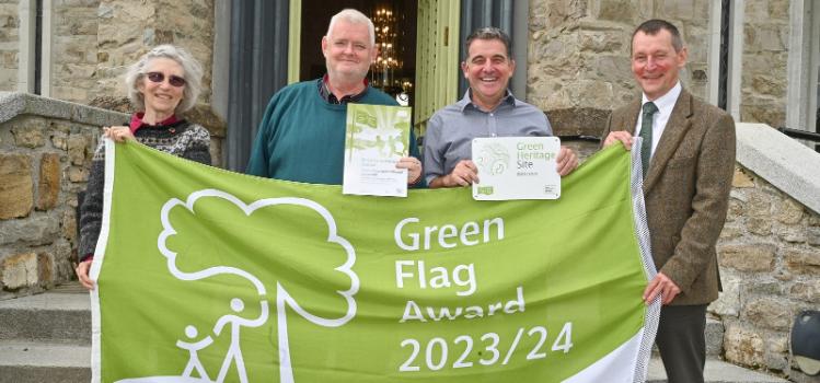 Queen's University Belfast receiving its Green Flag Award and Green Heritage Site award at the Green Flag Awards 2023-23. Pictured are Chair of Keep Northern Ireland Beautiful Board of Trustees, Dr Sue Christie OBE; Queen's Head Grounds Officer, Gary Thompson; Queen's Head Gardener, Paul Wallace; and Dr Ian Humphreys, Chief Executive of Keep Northern Ireland Beautiful