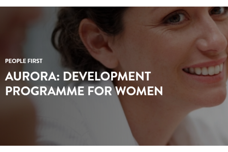 'Aurora Development Programme for Women' text overlaid on background of a smiling woman