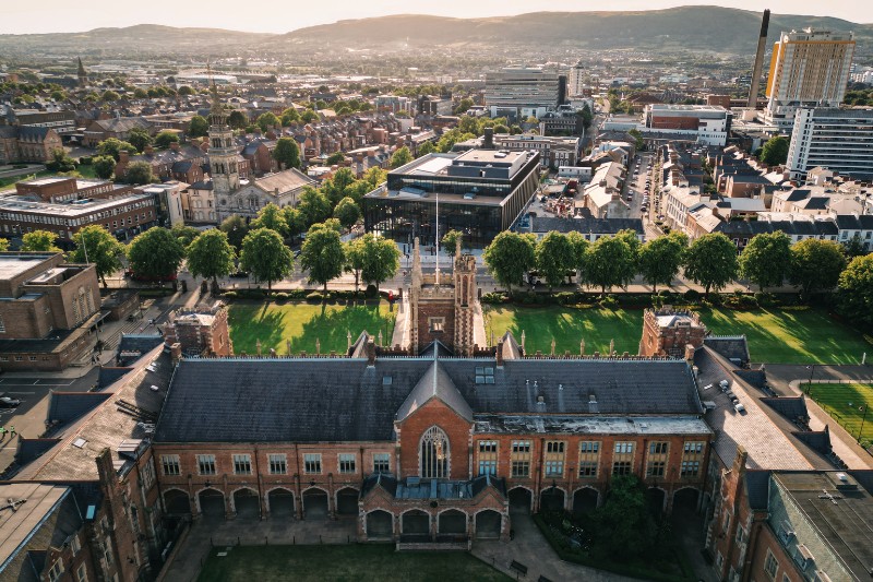 aerial view of the Lanyon Building, Queen's University Belfast, from the quad and inner facade looking towards the One Elmwood building and wider West Belfast