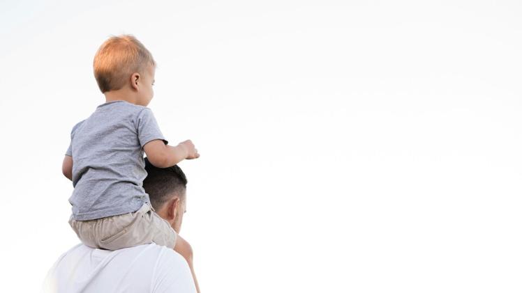 Child on parent's shoulders